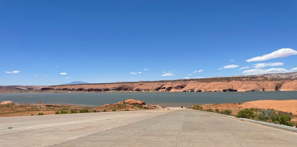 Concrete road leading to open water